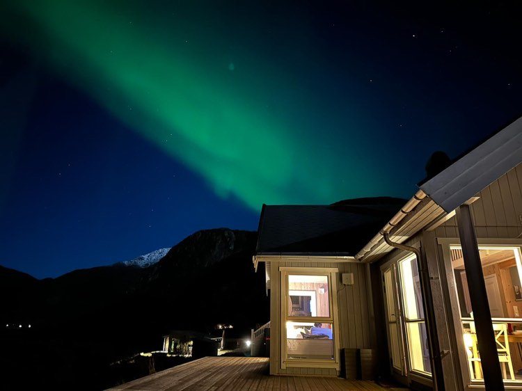 Northern lights over the cabin and the terrace