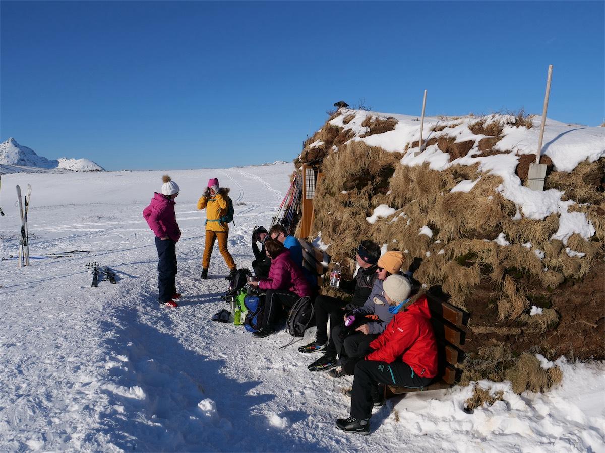 Skiers resting in the snow